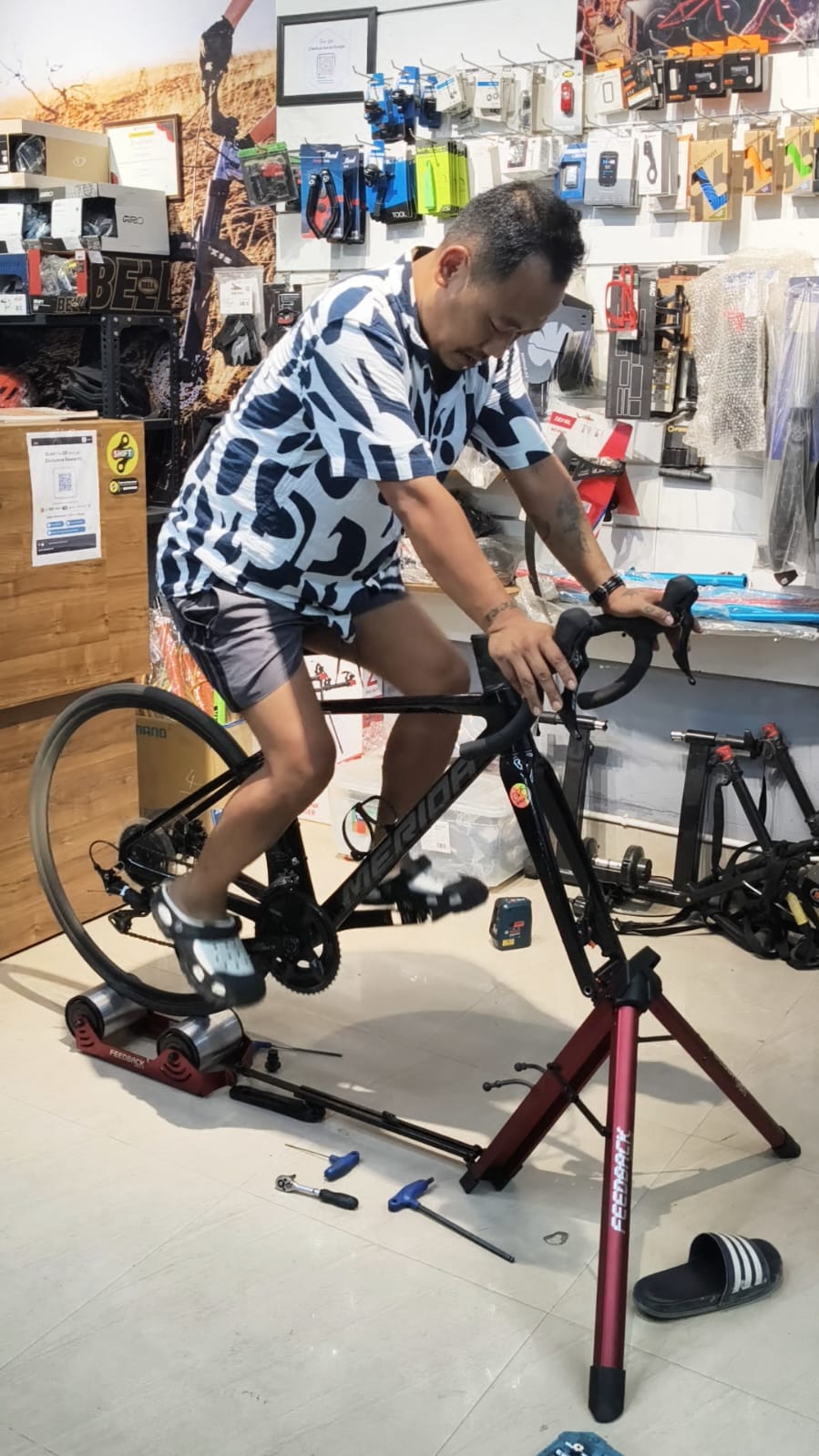 Client riding on a trainer during bike fitting